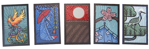 Karty świateł z naszej talii – mają zrobione lakierem promienie mieniące się w świetle